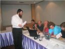 Chabad of Thailand Director Rabbi Yosef Chaim Kantor, at the command post on Thailand's remote island of Krabi, shares the good news with colleagues that a high risk missing person had been found safe and sound.