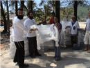Presenting beach chairs to a victim to restart her business